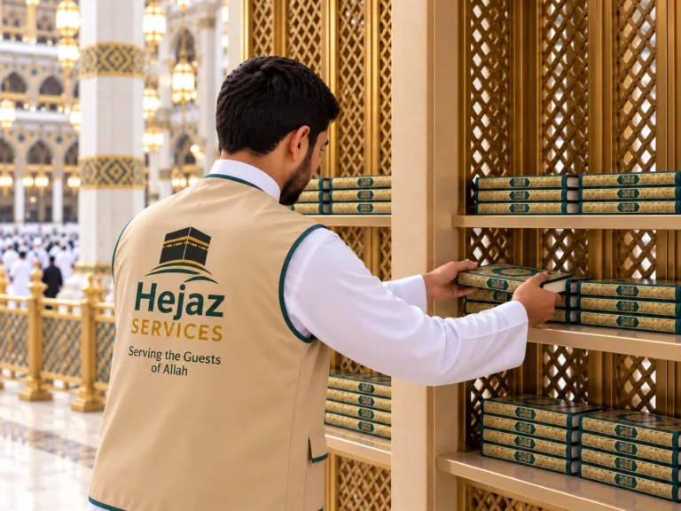 Hejaz Services volunteer placing Quran Mushafs on shelves inside the Haram